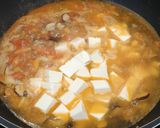 A picture of step 9 of Tomato mushroom tofu soup.