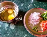 A picture of step 1 of Masala Omelette.