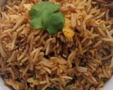 A picture of step 2 of Garlic n egg fried rice.
