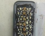 A picture of step 10 of Chocolate Biscuit Cake with Sugar coated Coconut Biscuits.