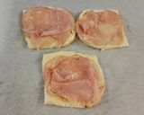 A picture of step 2 of Ham and Cheese Toasted Roll Ups.