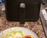 A picture of step 1 of Frozen French Bread Pizza (Air Fryer).