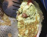 Foto del paso 3 de la receta: Omelette de huevo, pesto rúcula con queso y tomate