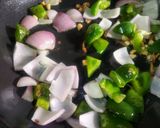A picture of step 5 of Capsicum Chilli Chitol Muitha.