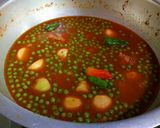 A picture of step 13 of Karahi style alu matr chicken ka salen.
