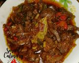 A picture of step 5 of Kibda (Egyptian liver sauce) and French fries.
