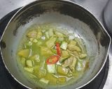 A picture of step 4 of Green Curry Chicken in Young Coconut.