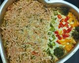 A picture of step 6 of Cheesy Maggi vegetable cake.
