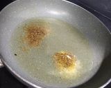 A picture of step 5 of Baingan bharta with spring onion.