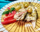 Foto del passaggio 5 della ricetta Nasello al cartoccio con uva, zenzero, limone e pepe di Sichuan