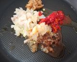 Foto del paso 6 de la receta: Arroz negro meloso con garbanzos y merluza rebozada