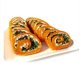 Foto del paso 10 de la receta Rollo de pimientos de piquillo relleno de rúcula, queso de cabra y nueces