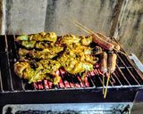A picture of step 9 of Chicken paprika drums Skewered red hot Shrimps and grilled sausages.