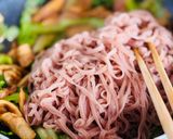 A picture of step 6 of Stir-Fried Brown Rice Pho with Octopus & Mustard Greens.
