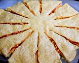 A picture of step 8 of Twisted pizza with tomato and cheese filling.