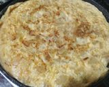 A picture of step 5 of Spanish Potato Omelette with Caramelized Onions.