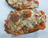 Foto del paso 4 de la receta Berenjenas rellenas con pisto y pollo, gratinadas