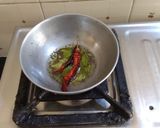 A picture of step 4 of Gujarati lunch (rasadar aloo sabji, amrakhand, puri, dal, rice).