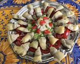 Une image de l'étape 10 de Salade de coeurs d'artichauts aux tomates, concombre et fleurs de thym.