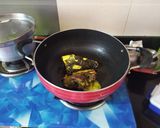 A picture of step 1 of Muri Ghonto (Fish head curry with lentils).