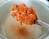 A picture of step 6 of Broken rice tomato bath.