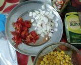 A picture of step 1 of Sweet corn kernels Tomato onion salad.