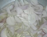A picture of step 2 of Matar Pulao.