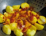 A picture of step 3 of Masala baby potatoes.