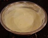 A picture of step 11 of Patriotic Vanilla Cake Roll with Whipped White Chocolate Ganache Filling and Frosting.