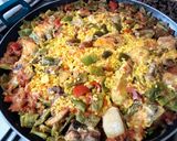A picture of step 10 of Chicken and Pork Rib Paella.