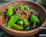 A picture of step 5 of Masala bhari mirchen.
