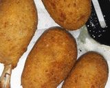 A picture of step 13 of Cheesy chicken drumsticks.