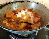 A picture of step 9 of Onion Tomato Chicken.