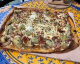 Une image de l'étape 14 de Pizza jambon tomate artichaut champignons emmental et mozzarella.