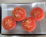 A picture of step 4 of Baked Tomatoes with Beans & Cheese.