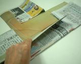 A picture of step 6 of Castella Cake in a Newspaper Mold.