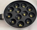 A picture of step 9 of Healthy Atta Jaggery Muffins in Appe Pan.