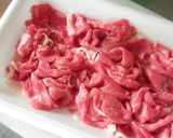 A picture of step 1 of Marinated Beef and Onions.