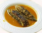 A picture of step 7 of Spicy aromatic nutritious stuffed bitter gourd in tomato sauce.