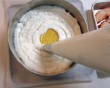 A picture of step 13 of Le Fraisier Style White Chocolate Cake.
