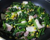 A picture of step 4 of Spinach and King Oyster Mushrooms Sauteed With Butter and Soy Sauce.