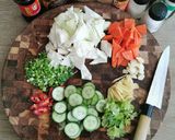 A picture of step 1 of Spicy cabbage, carrot and cucumber pickle.