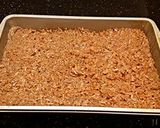 A picture of step 8 of Toasted Coconut Caramel Cashew Bars.