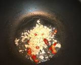 A picture of step 3 of Spicy soy sauce chicken with onion and green pepper.
