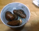 A picture of step 1 of Simmered Daikon Radish, Carrot, Shiitake Mushrooms and Aburaage.