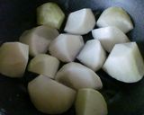 A picture of step 1 of Chinese-Style Simmered Daikon Radish and Pork.