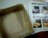 A picture of step 8 of Castella Cake in a Newspaper Mold.