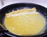 Une image de l'étape 10 de Tamagoyaki (omelette japonaise sucrée).