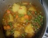 A picture of step 6 of Spicy Potato Curry with Carrots and Peas.