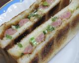 A picture of step 4 of Weiner Sausage Toasted Sandwich with Green Onions.